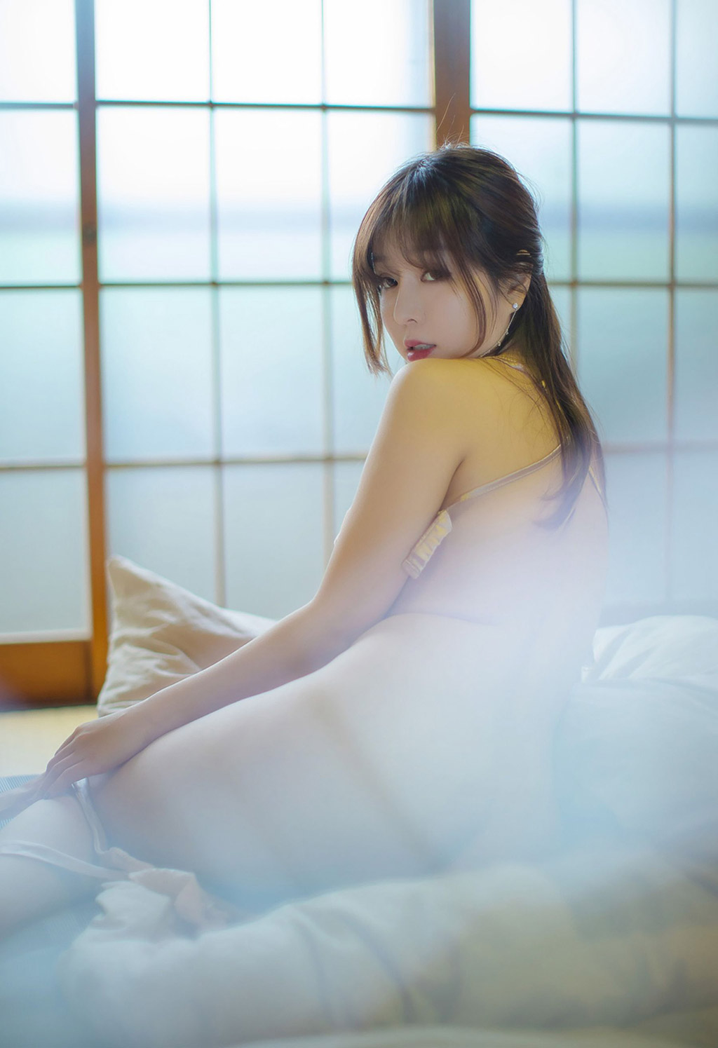 Wang Yuchun's light, thin, see-through underwear vaguely revealing her delicate body.