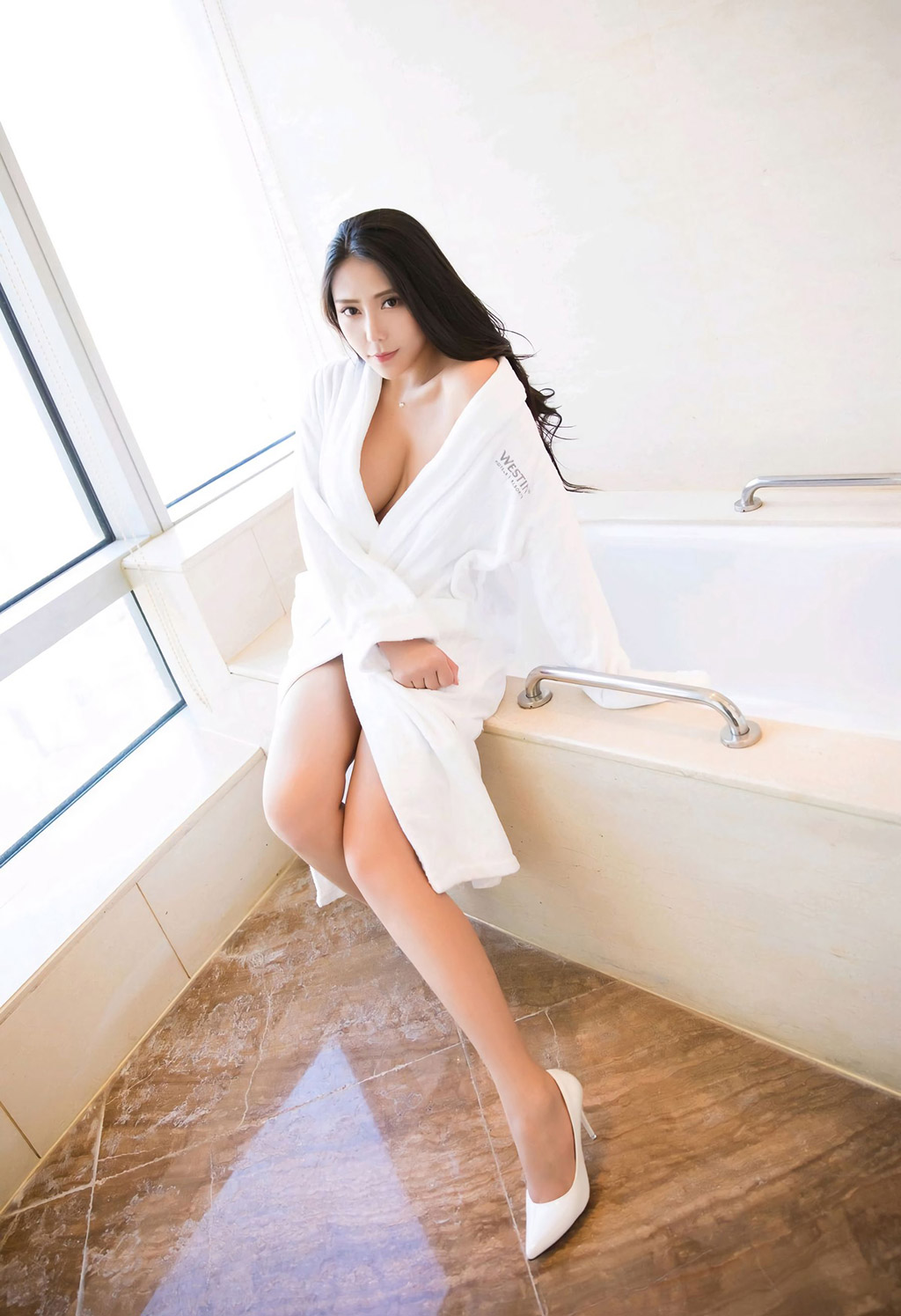 Anker's hollowed-out lingerie and the perfect huge breasts under the bathrobe.