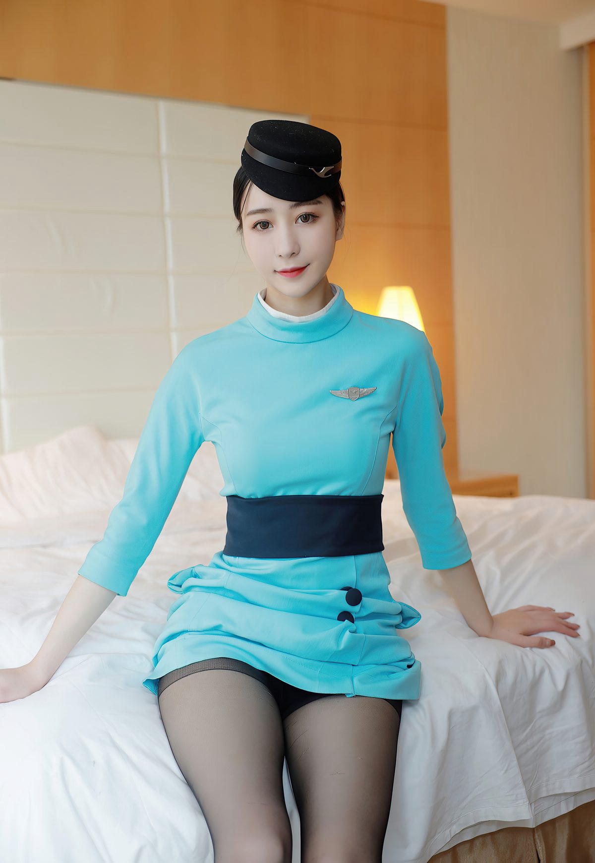 Sexy flight attendant in black stockings, beautiful legs, high heels, uniform, seductive flirtatious poses.