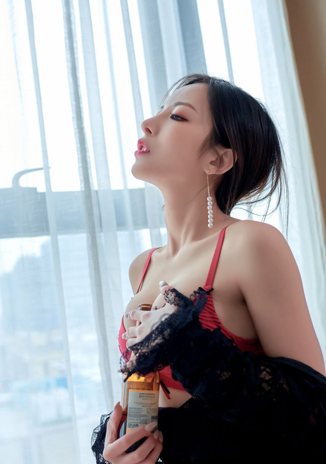 Red lingerie beauty with premium beautiful breasts temptation, perky buttocks, flesh-colored stockings, and beautiful legs.